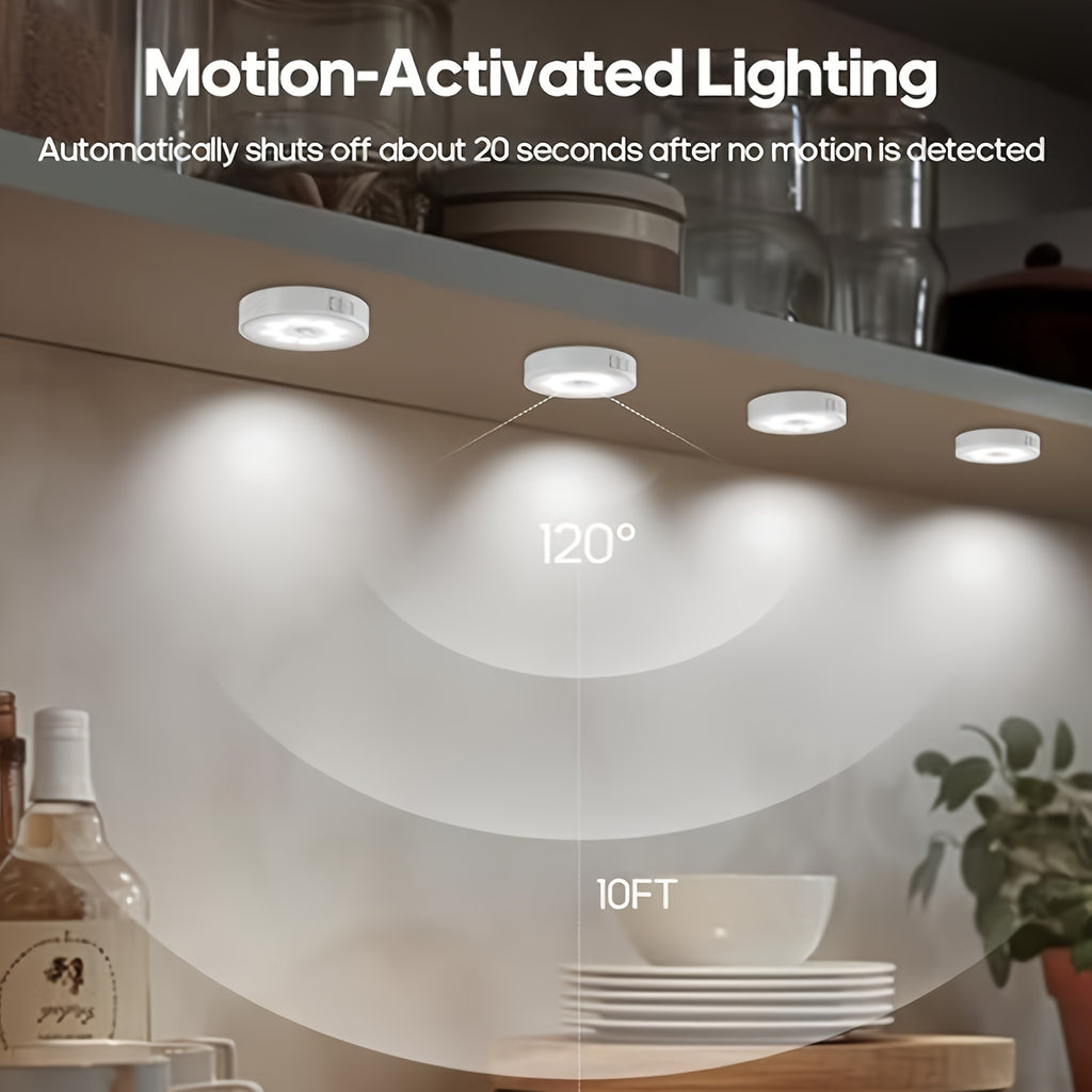 Motion sensor puck lights glowing under a kitchen shelf
