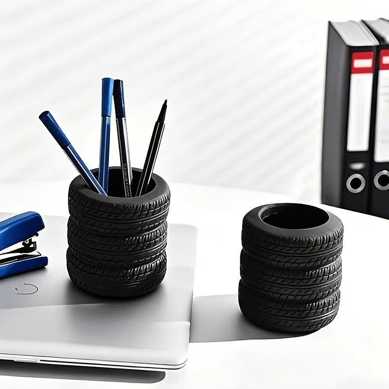 Black tire-shaped pencil holders on a desk