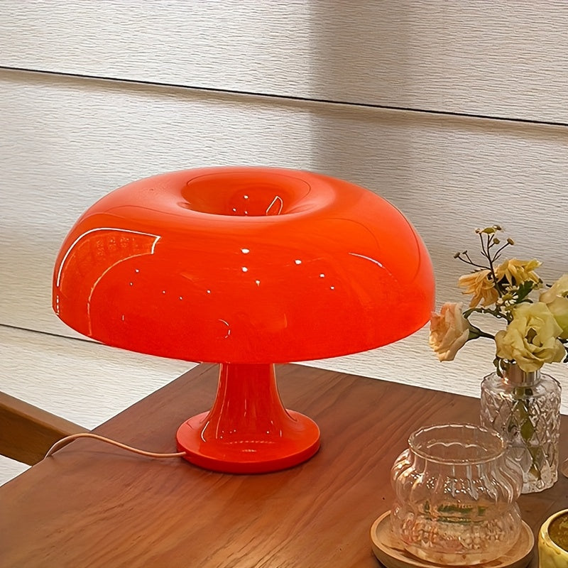 Orange LED mushroom table lamp on a side table