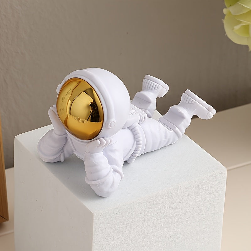 Astronaut phone stand on a desk
